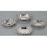 A group of four pierced silver bonbon dishes, various dates and makers marks, the largest 12cms