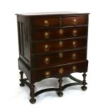 An 18th / 19th century oak chest on stand with two short and four graduated long drawers, on