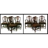 A set of eight (including two carvers) Hepplewhite style mahogany shield back dining chairs with