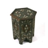 An Islamic occasional table of hexagonal form with metal and bone overlaid decoration, 38cms
