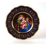 A Worcester cabinet plate decorated with The Madonna and Christ, after Raphael, within a blue and