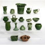 A quantity of early Rye Pottery green glazed miniature dolls house vases, jugs, baskets and