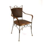 A Carlo Bugatti style wirework and cane armchair.