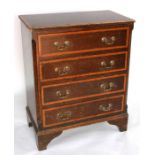 A mahogany chest of small proportions with four graduated long drawers, on bracket feet, 62cms