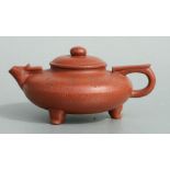 A Chinese Yixing pottery teapot with incised bamboo decoration and calligraphy, four character