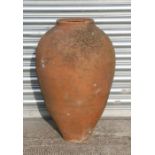 A large terracotta olive jar, approx 63cms high.