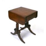 An early 19th century mahogany drop-flap work table with single frieze drawer opposing two faux