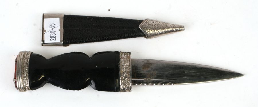 A Scottish Sgian Dubh, the blade signed 'J Nowill & Sons Ltd, in a leather scabbard, 20cms long;