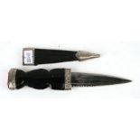A Scottish Sgian Dubh, the blade signed 'J Nowill & Sons Ltd, in a leather scabbard, 20cms long;