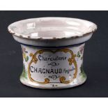 A Faience tin glazed earthenware bowl decorated with rabbits and inscription 'Charcuterie Chagnaud