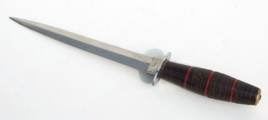 A French FS style Commando knife marked BEGON INOX on the ricasso and having a stacked leather