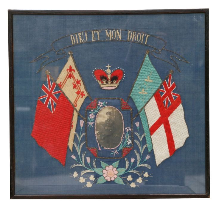 A WWI embroidery of an unknown British Army sergeant in uniform flanked by the flags of the United