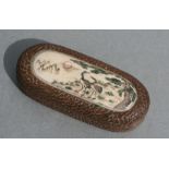 A Japanese hardwood snuff box with hinged lid with inset bone panel decorated with birds within a