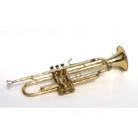 A Boosey & Hawkes brass trumpet, numbered 019142, cased.