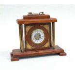 A mahogany and Brass West German mantle clock, the dial signed 'Mercedes', 25cms high.