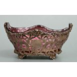A late Victorian pierced silver basket with original cranberry glass liner, London 1901 and makers