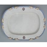 A 19th century meat plate with puce mark for Daniell & Co , decorated with family crests. 48cm wide