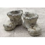 A pair of reconstituted stone boot planters. 27cm high