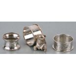 Two silver napkin rings together with a silver plated teddy napkin rind ( 3)