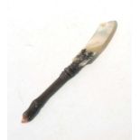 A late Victorian / Edwardian Scottish mother of pearl and white metal paper knife, the handle in the