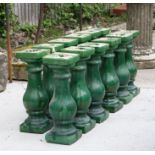 A set of twelve green glazed baluster columns, each 49cms high (12).