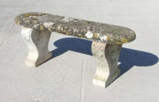 A well weathered garden stoneware bench, 116cms wide.