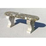 A well weathered garden stoneware bench, 116cms wide.