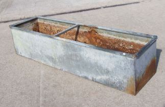 A large galvanised planter / trough. 183 by 49cm