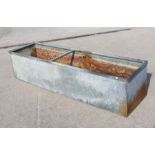 A large galvanised planter / trough. 183 by 49cm