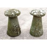 A pair of well weathered staddle stones with carved stone bases and carved stone tops, each approx