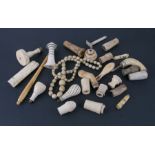 A string of late 19th century graduated ivory beads, together with ivory and bone walking stick