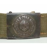 A WWII German Army Wermacht belt buckle on later belt.Condition ReportBelt is not dated