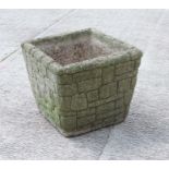A well weathered reconstituted planter of square form, 40cms wide.