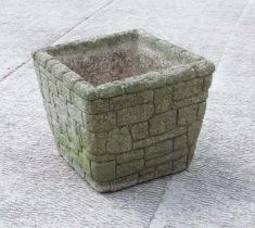 A well weathered reconstituted planter of square form, 40cms wide.