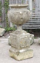A reconstituted stone urn on stand (a/f); together with a stoneware garden goose (2).