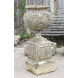 A reconstituted stone urn on stand (a/f); together with a stoneware garden goose (2).