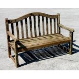 A hardwood slatted garden bench, reduced in height, 120cms wide.