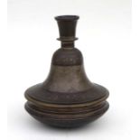 A Middle Eastern / Islamic two-piece hookah pipe base of bell form with engraved foliate scrolls,