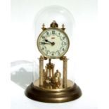 A Schatz 400-day Anniversary clock under a glass dome with original instruction book, 30cms high.