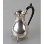 A George III style silver water jug of waisted form, on hoof feet, Chester 1922, 410g, 18cms high.