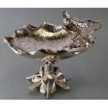 A large Victorian silver plated fruit bowl in the form of a large flower, with engraved decoration