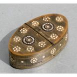 An early 19th century horn snuff box of navette form, 9cms wide.