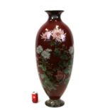 A very large Japanese cloisonné floor vase decorated with chrysanthemums on a ruby red ground, 39.