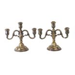 A pair of silver plated three-arm candelabra, 27cms high.Condition ReportPlate worn.