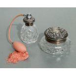 A silver topped cut glass perfume atomiser, 12cms high; together with a similar silver topped