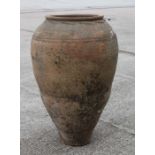A terracotta olive jar of traditional form form with sgraffito decoration, approx 66cms high.