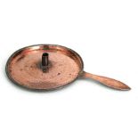 An 18th century oversized copper chamberstick with wriggle work type decoration (converted from a