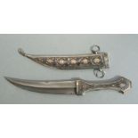 An Iraqi Marsh Arab silver, niello and gold inlaid dagger, 33cms long.