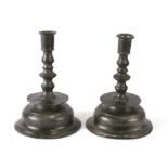 A pair of 17th century style pewter candlesticks, 17cms high (2).