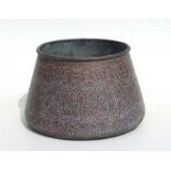 A Mamluk revival copper palm pot with engraved Islamic script decoration, 17cms high.